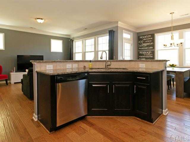 1403 Van Page Boulevard Raleigh, NC 27607 - Photo 10 of 25 a kitchen with granite countertop a stove and a sink