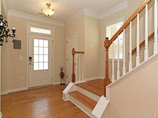 1403 Van Page Boulevard Raleigh, NC 27607 - Photo 3 of 25 wooden floor with windows and entryway