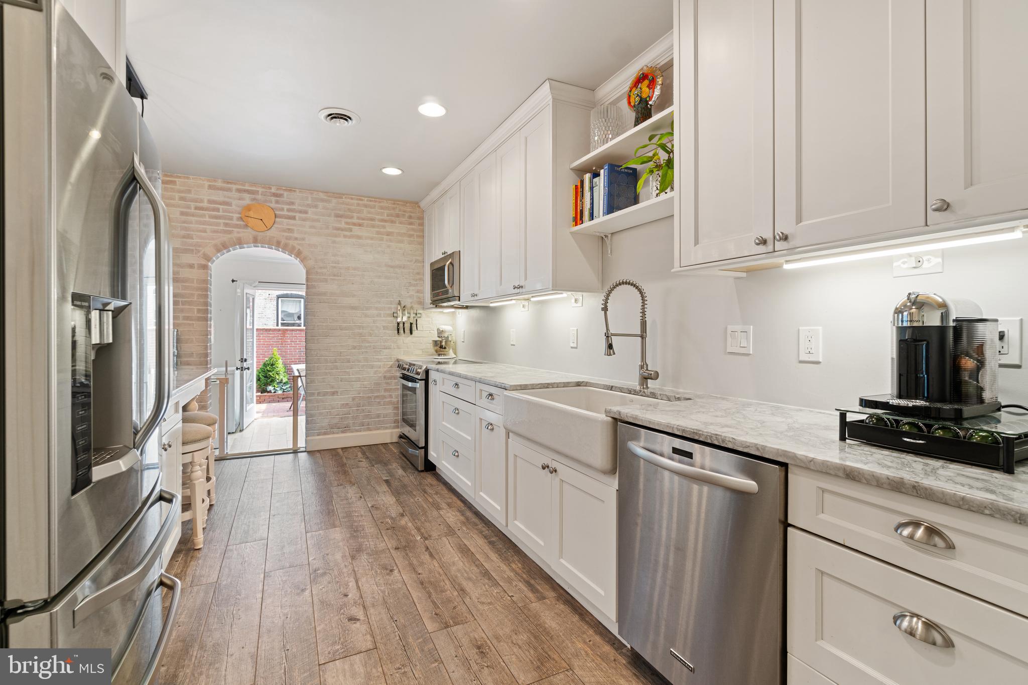 2531 Eastern Avenue Baltimore, MD 21224 - Photo 12 of 49 Kitchen with whitewashed brick wall