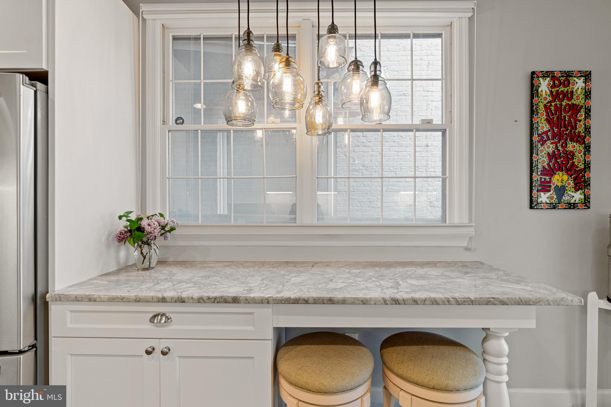 2531 Eastern Avenue Baltimore, MD 21224 - Photo 15 of 49 Luxe pendant lighting above breakfast bar