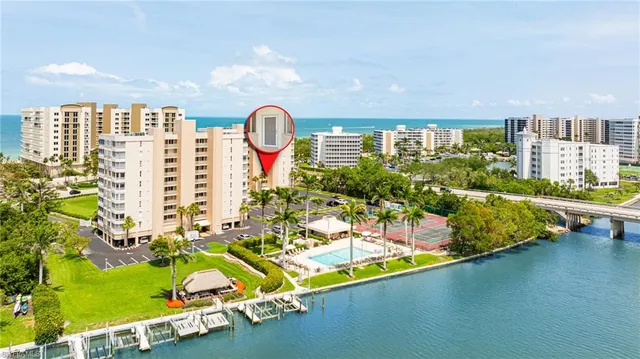 a view of swimming pool with outdoor seating and plants