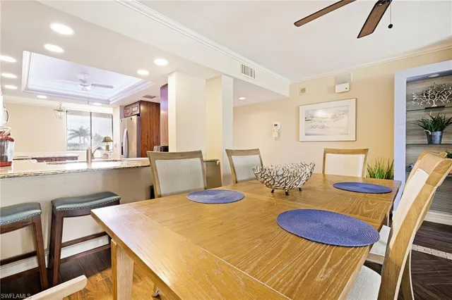 a dining room with furniture and wooden floor