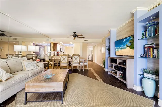 a living room with fireplace furniture and a flat screen tv