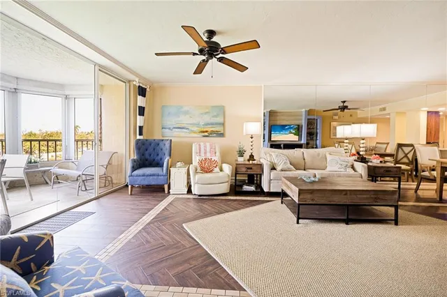 a living room with furniture or couches and a large window