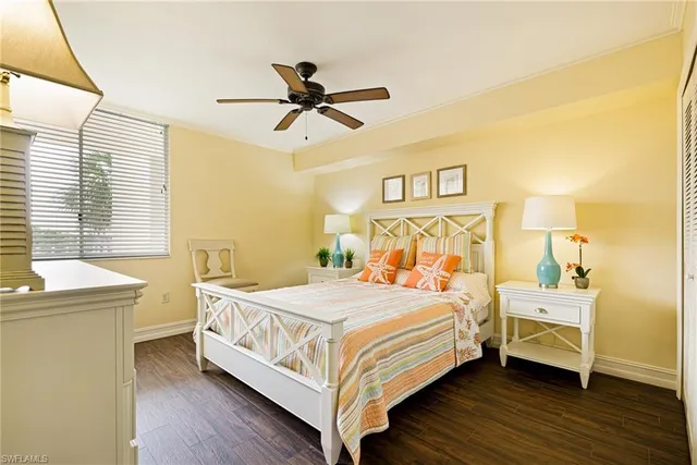 a bedroom with a bed and a table