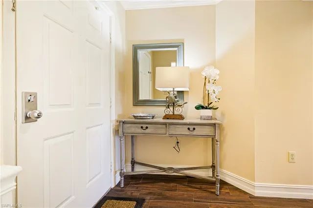 a view of bathroom with a sink and mirror