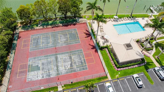 an aerial view of a house with a garden and outdoor seating