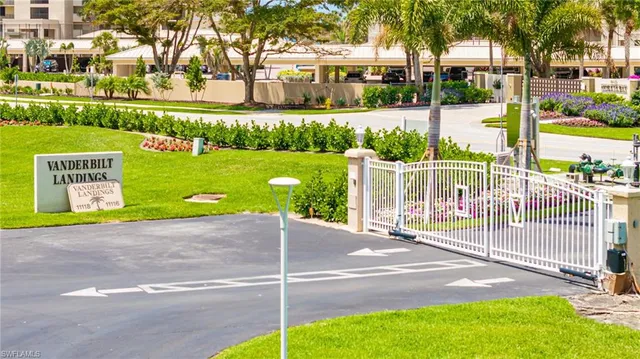 a view of a garden with a building in the background