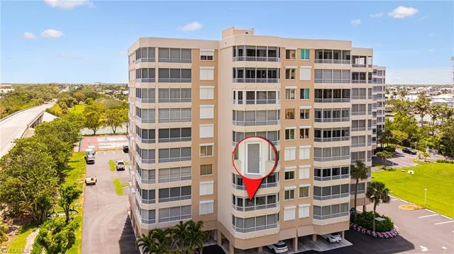 a front view of a building with a garden and entertaining space