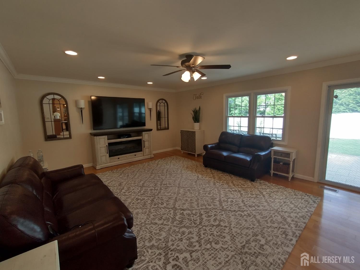 18 Timber Road East Brunswick, NJ 08816 - Photo 16 of 38 a living room with furniture and a flat screen tv