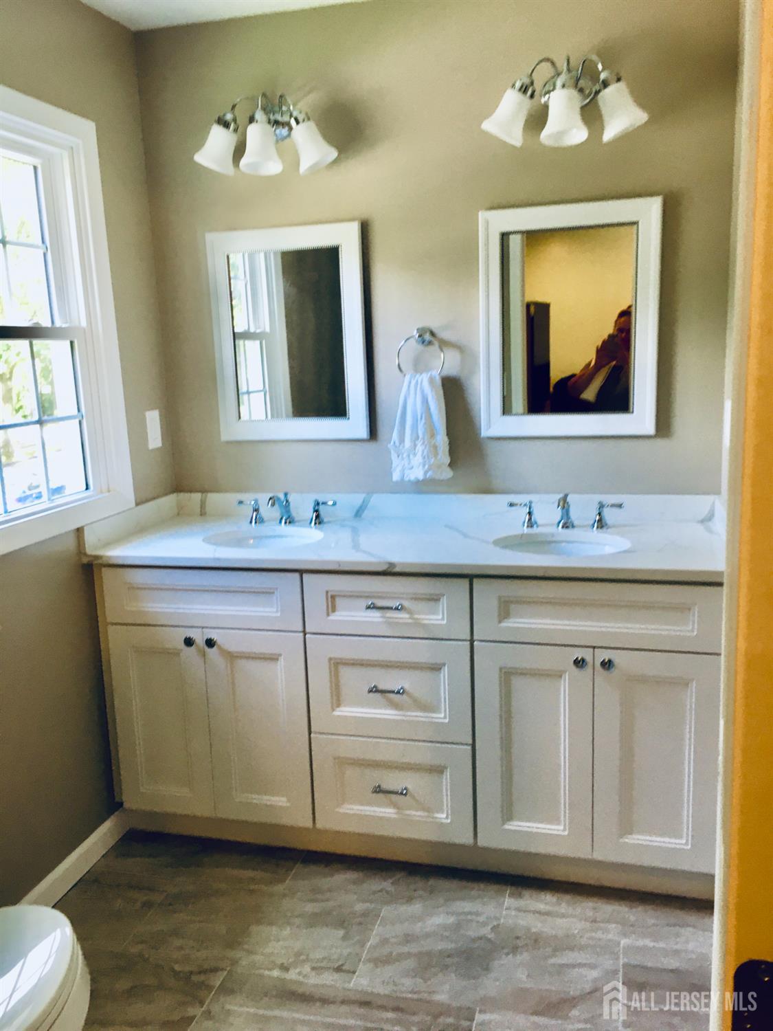 18 Timber Road East Brunswick, NJ 08816 - Photo 27 of 38 a bathroom with a sink vanity and mirror