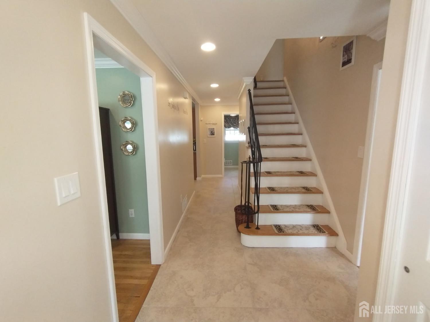 18 Timber Road East Brunswick, NJ 08816 - Photo 3 of 38 a view of entryway with wooden floor and stairs