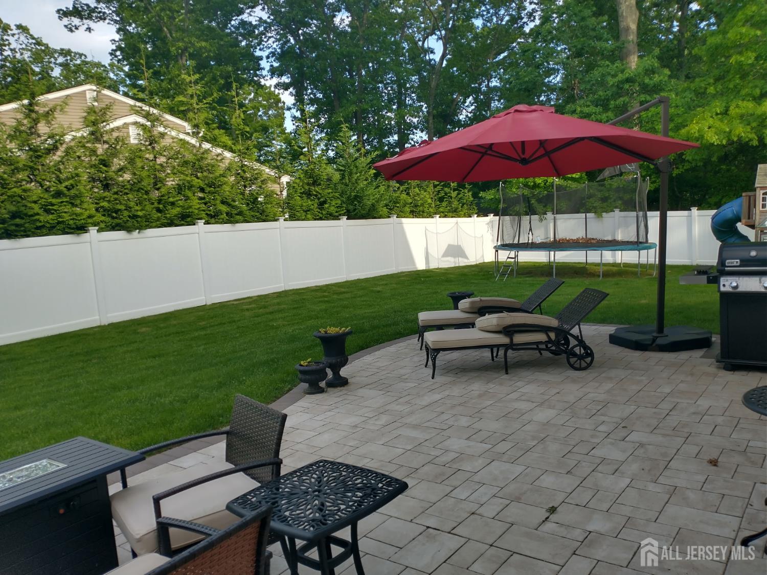 18 Timber Road East Brunswick, NJ 08816 - Photo 34 of 38 a view of a backyard with furniture and a garden