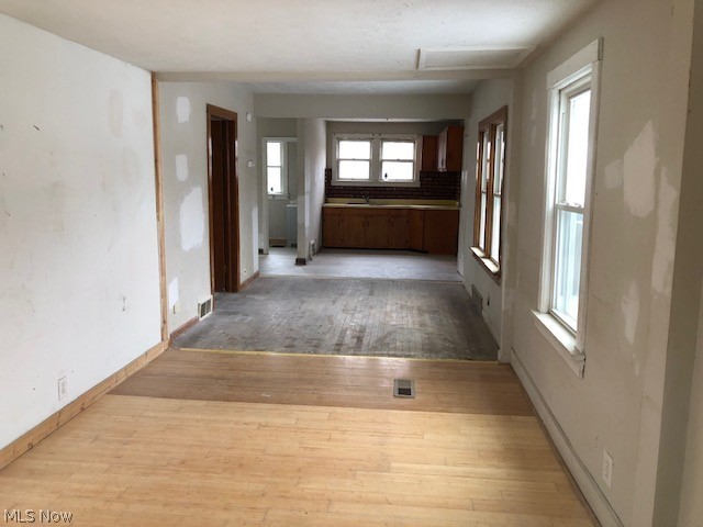 8806 Fosdick Road Cleveland, OH 44125 - Photo 10 of 28 Living room view into dining room and kitchen