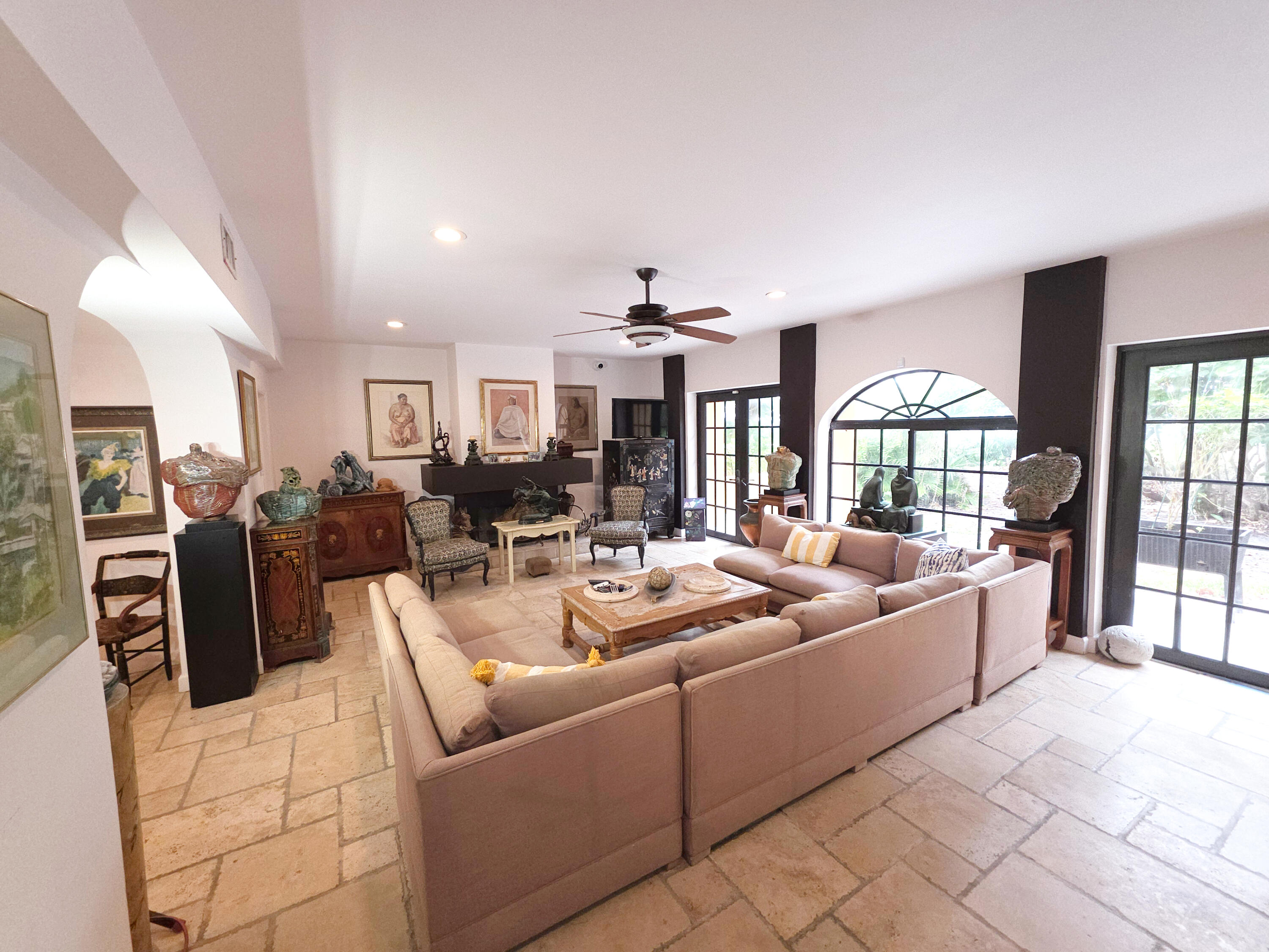 4200 North Surf Road Hollywood, FL 33019 - Photo 11 of 33 a living room with furniture a large window and a chandelier