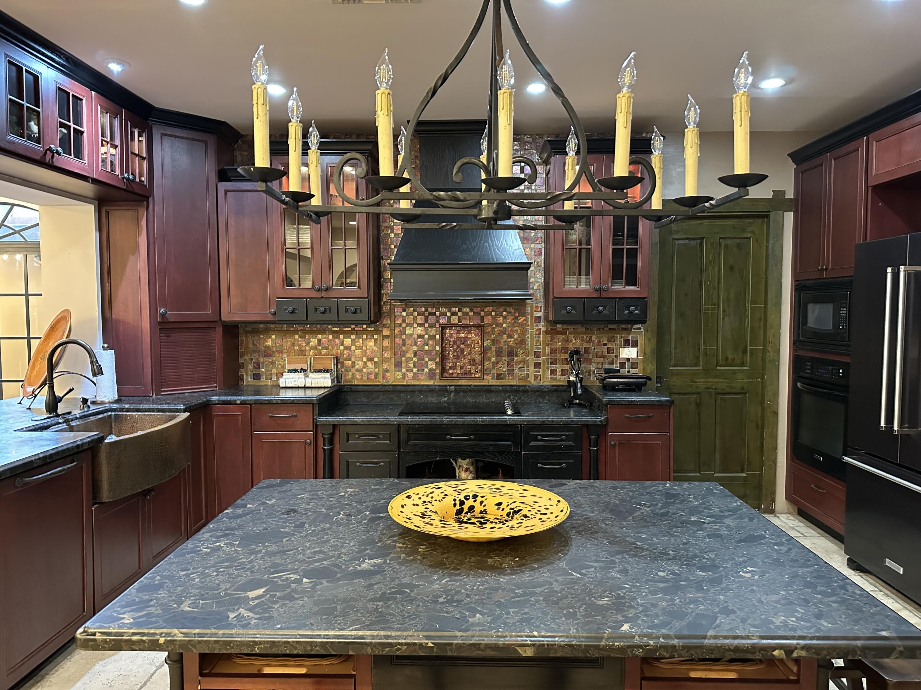 4200 North Surf Road Hollywood, FL 33019 - Photo 17 of 33 a kitchen with stainless steel appliances granite countertop a sink stove and refrigerator