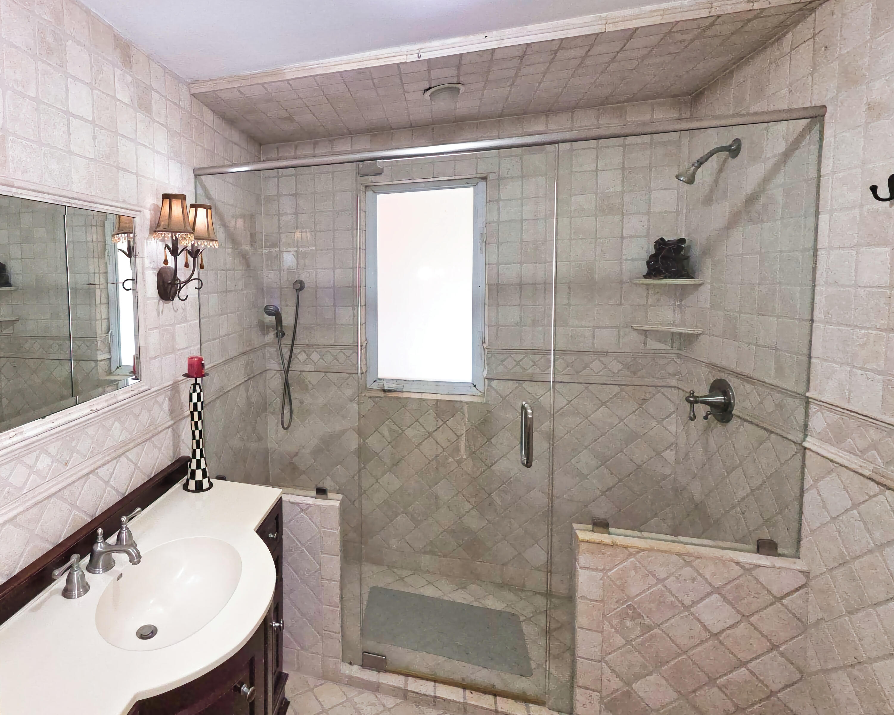 4200 North Surf Road Hollywood, FL 33019 - Photo 26 of 33 a bathroom with a sink and shower
