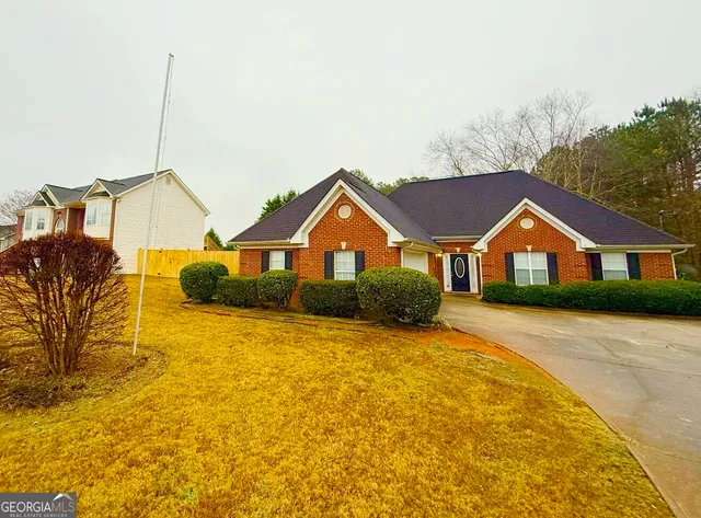 a view of house with yard and street view