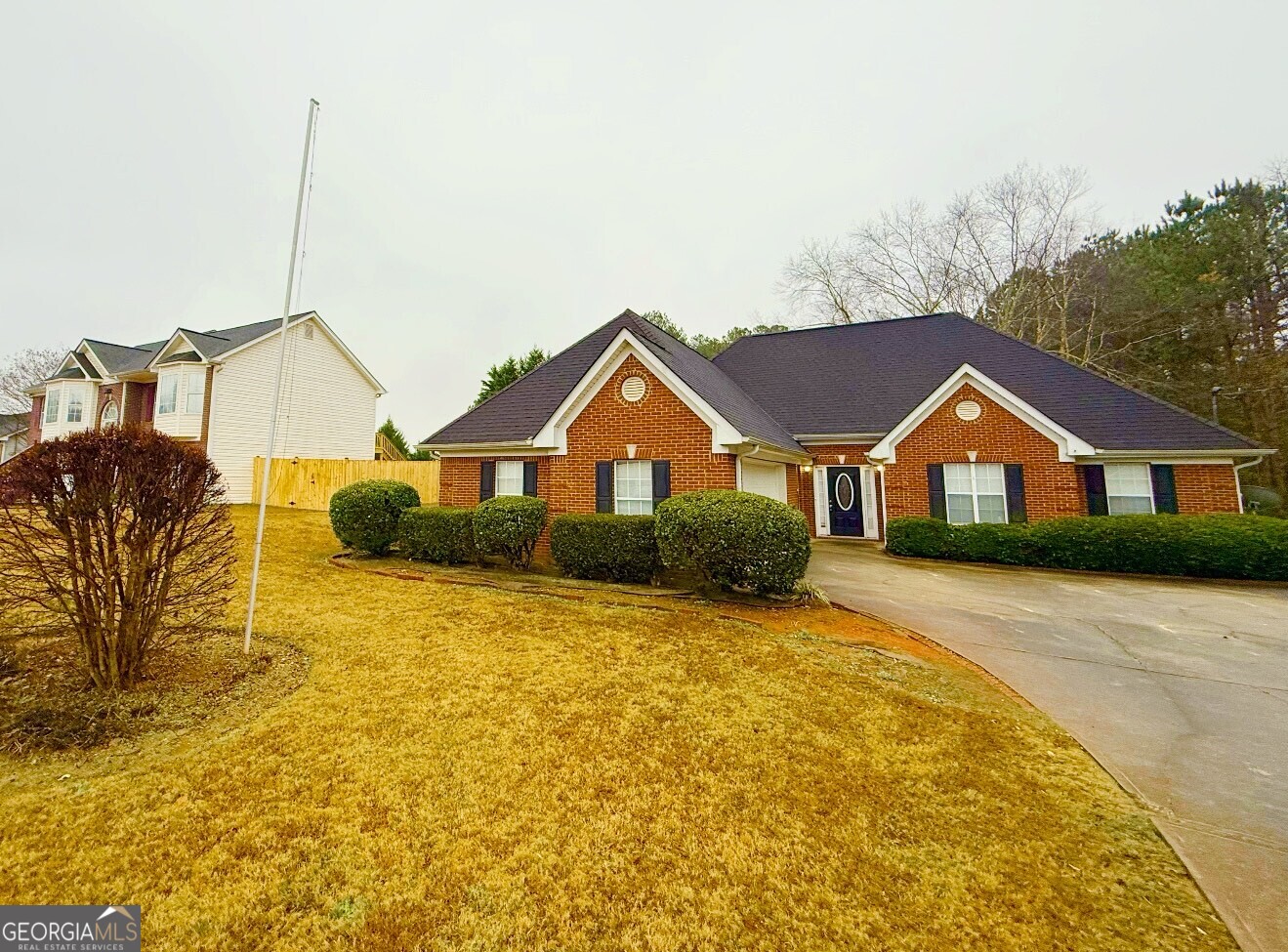 a view of house with yard and street view