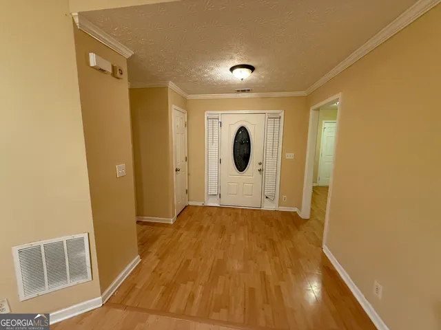 a view of a storage & utility room with a sink