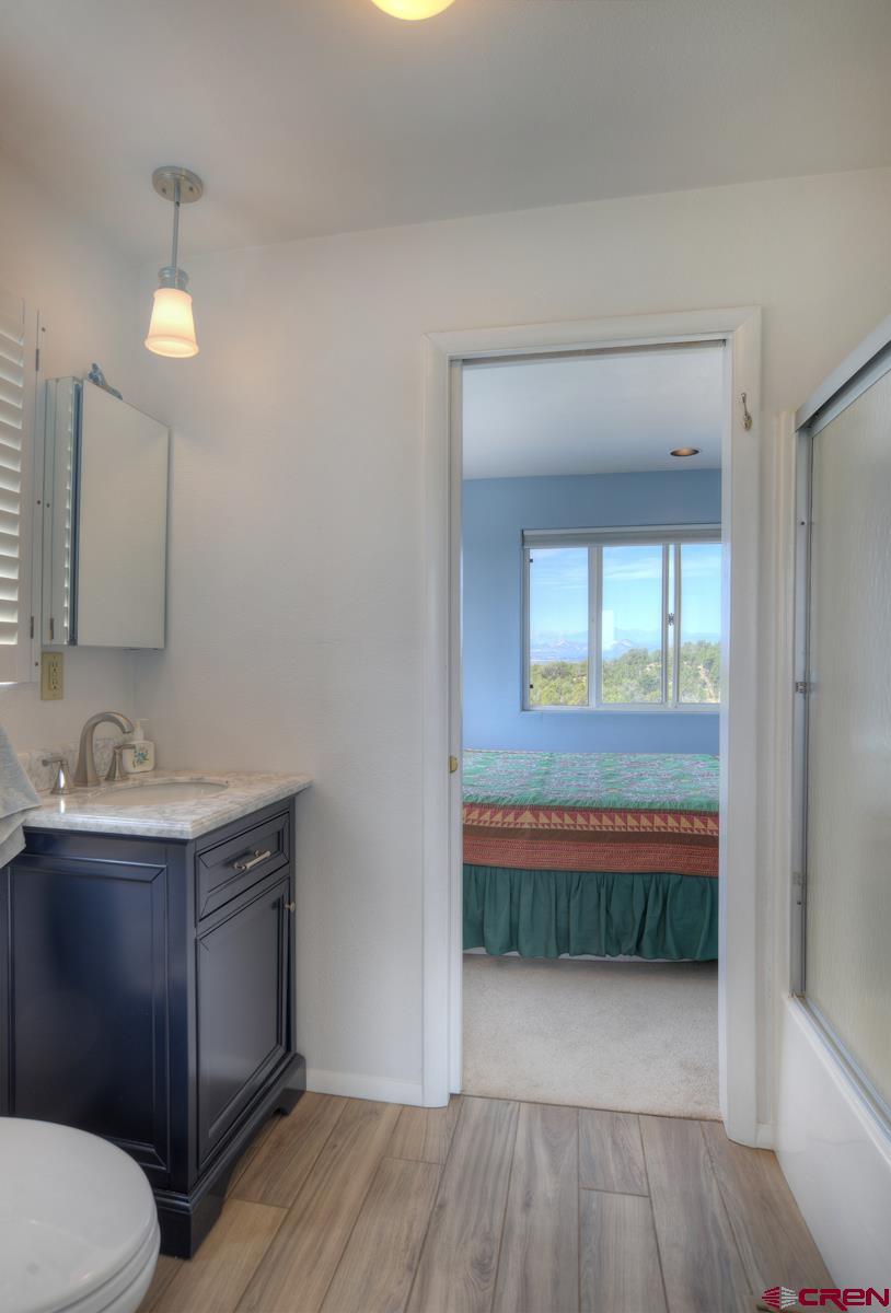 177 Sundance Hills Road Durango, CO 81303 - Photo 24 of 35 a bathroom with a sink and a mirror
