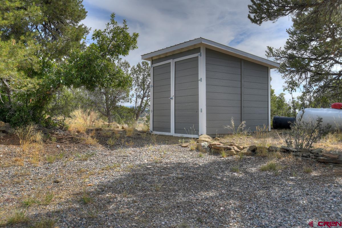 177 Sundance Hills Road Durango, CO 81303 - Photo 32 of 35 a front view of a house with a yard
