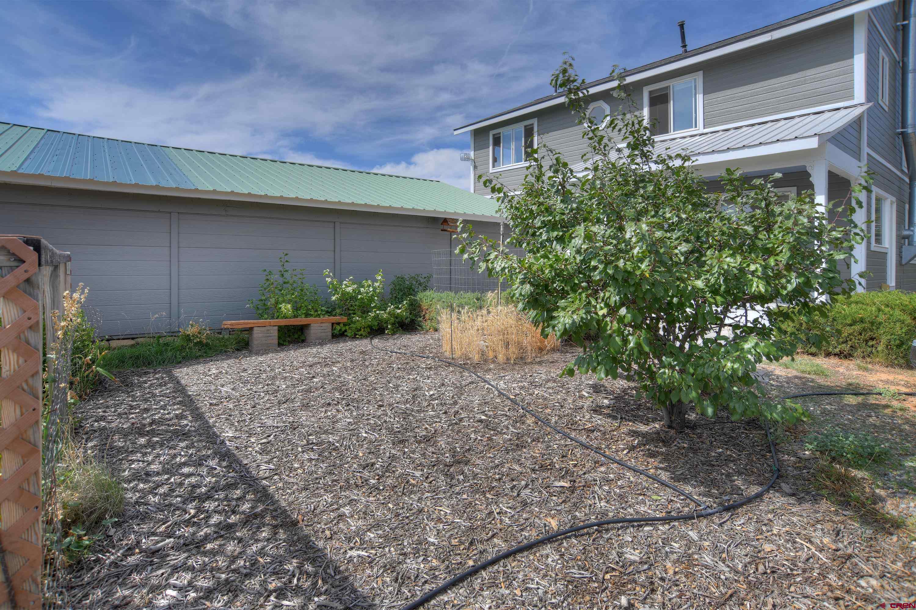 177 Sundance Hills Road Durango, CO 81303 - Photo 5 of 35 a front view of a house with garden