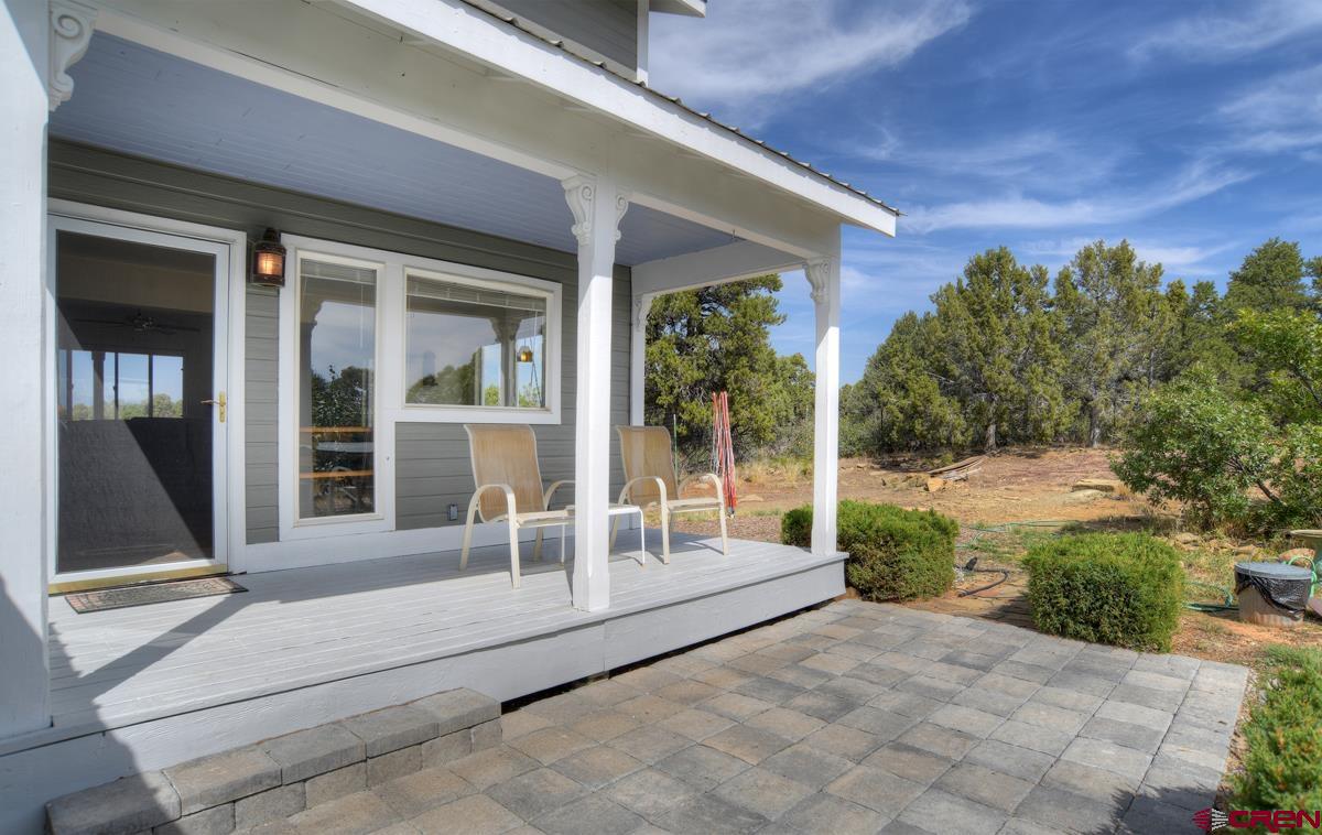177 Sundance Hills Road Durango, CO 81303 - Photo 6 of 35 a view of a house with porch and wooden floor