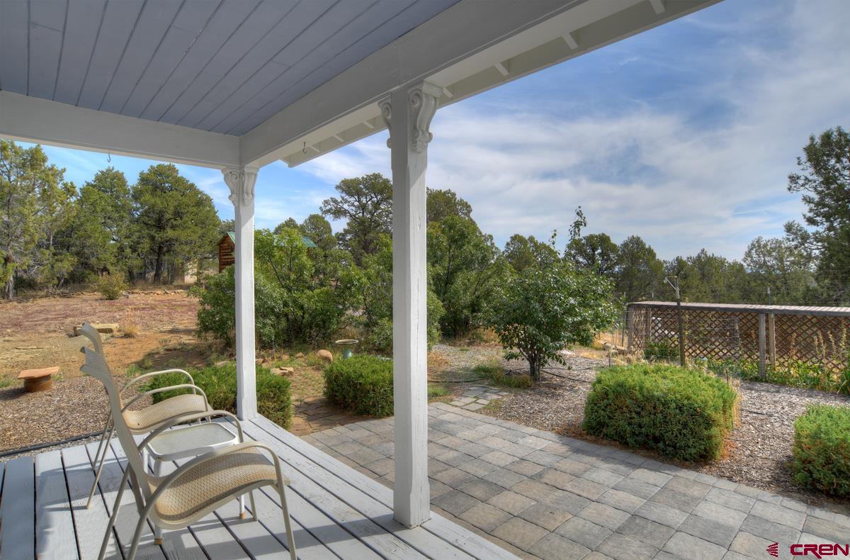177 Sundance Hills Road Durango, CO 81303 - Photo 7 of 35 a view of a balcony with chair and table