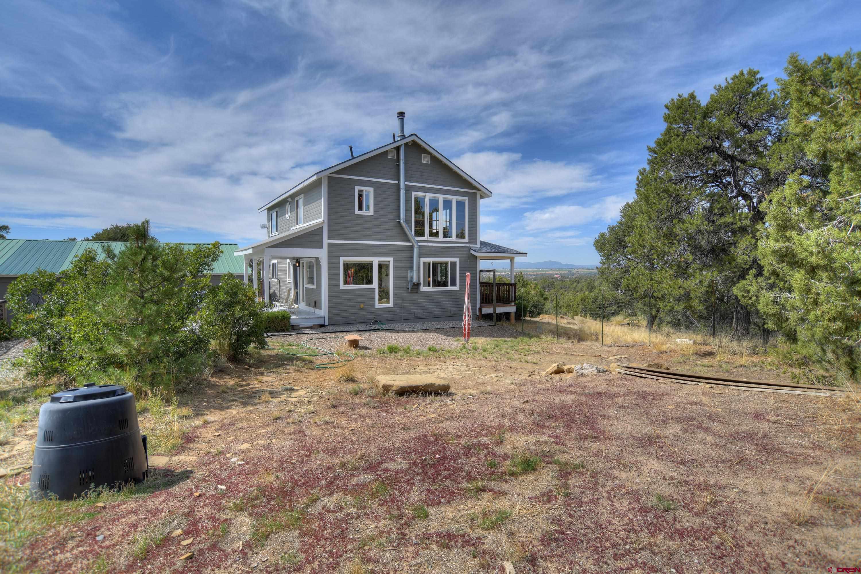 177 Sundance Hills Road Durango, CO 81303 - Photo 8 of 35 a front view of a house with a yard