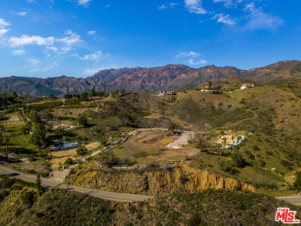 1665 Encinal Canyon Road Malibu, CA 90265 - Photo 14 of 15 a view of a house with a mountain