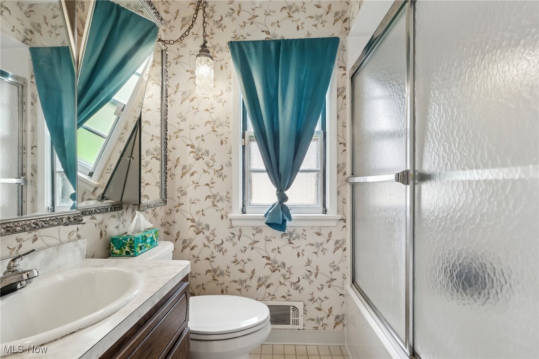 13676 Whitney Road Strongsville, OH 44136 - Photo 27 of 46 Bathroom featuring vanity, toilet, visible vents, tile patterned flooring, and wallpapered walls