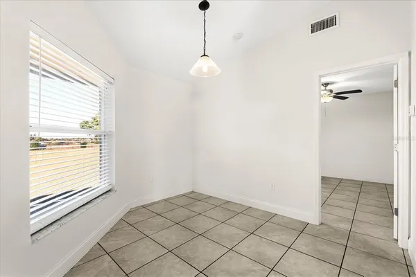 a view of an empty room and window