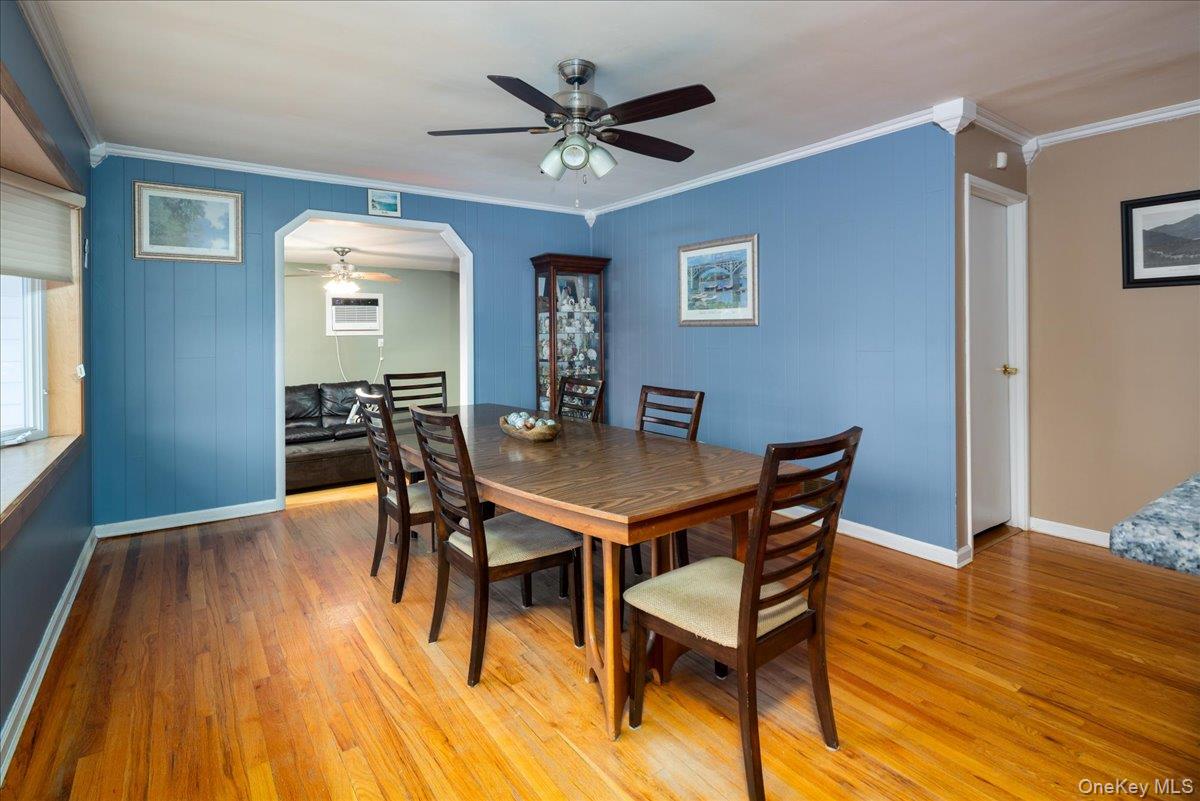 11 Adelphi Road Hicksville, NY 11801 - Photo 5 of 26 a dining room with furniture and wooden floor