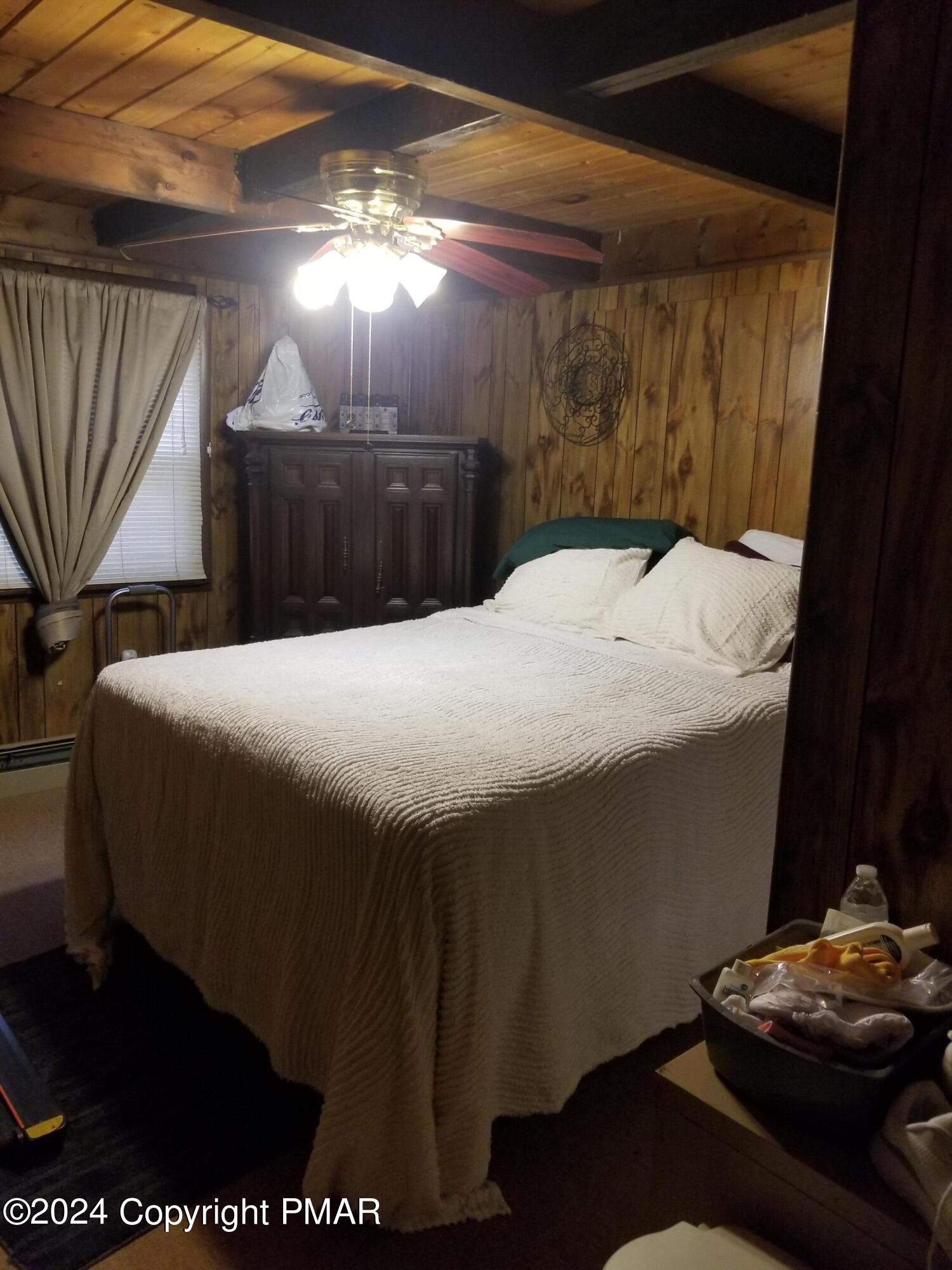 6349 Decker Road Bushkill, PA 18324 - Photo 13 of 28 a bedroom with a bed and a mirror