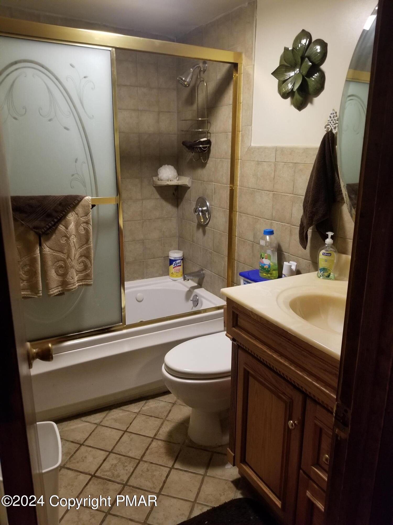 6349 Decker Road Bushkill, PA 18324 - Photo 14 of 28 a bathroom with a sink a toilet and shower