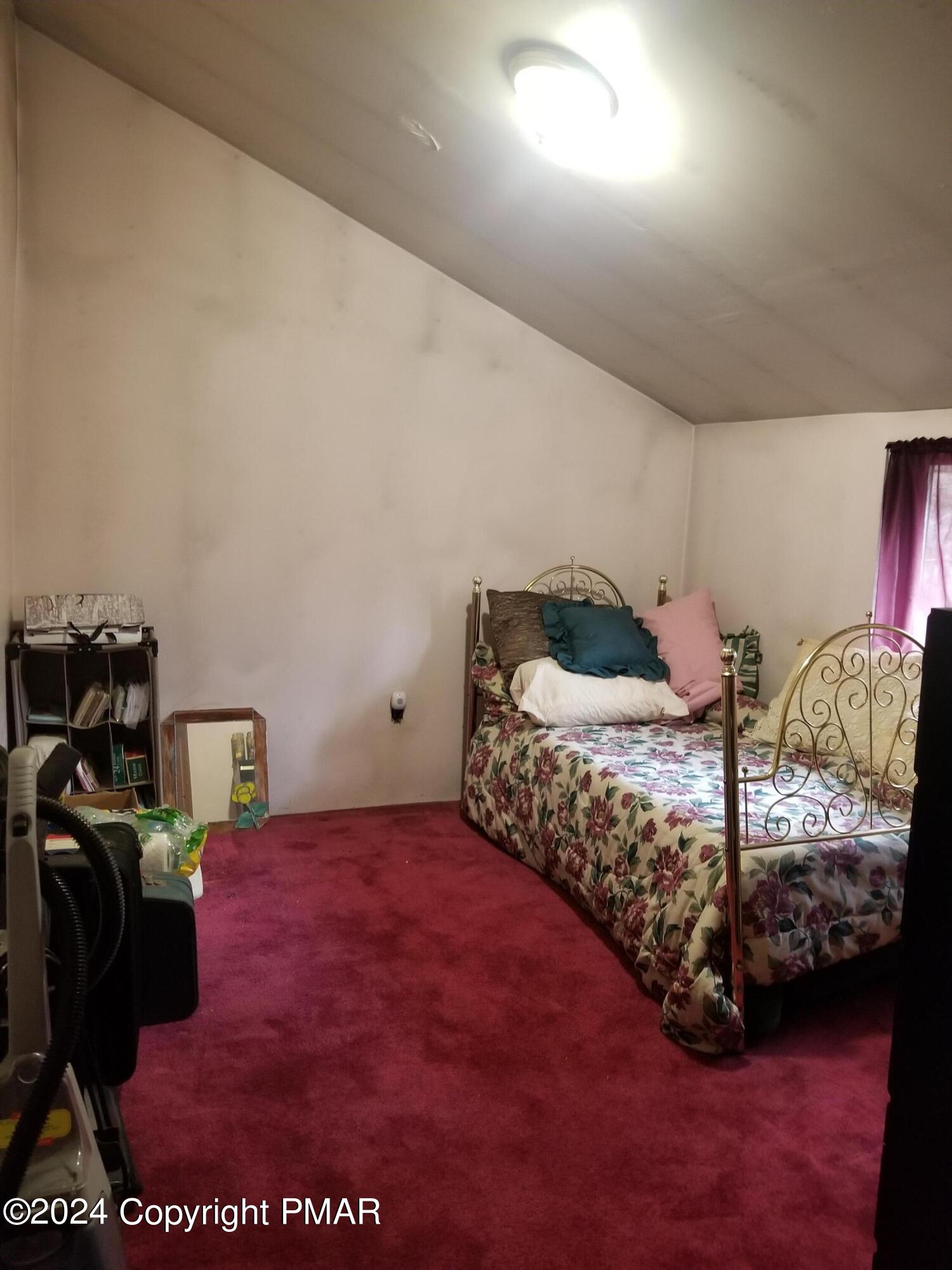 6349 Decker Road Bushkill, PA 18324 - Photo 20 of 28 a bedroom with a bed and a window