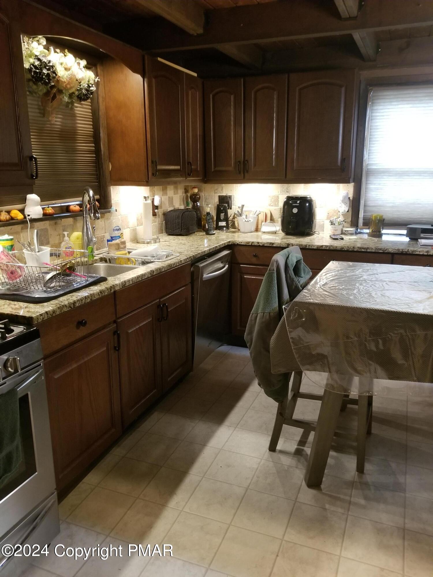 6349 Decker Road Bushkill, PA 18324 - Photo 8 of 28 a kitchen with a sink and cabinets