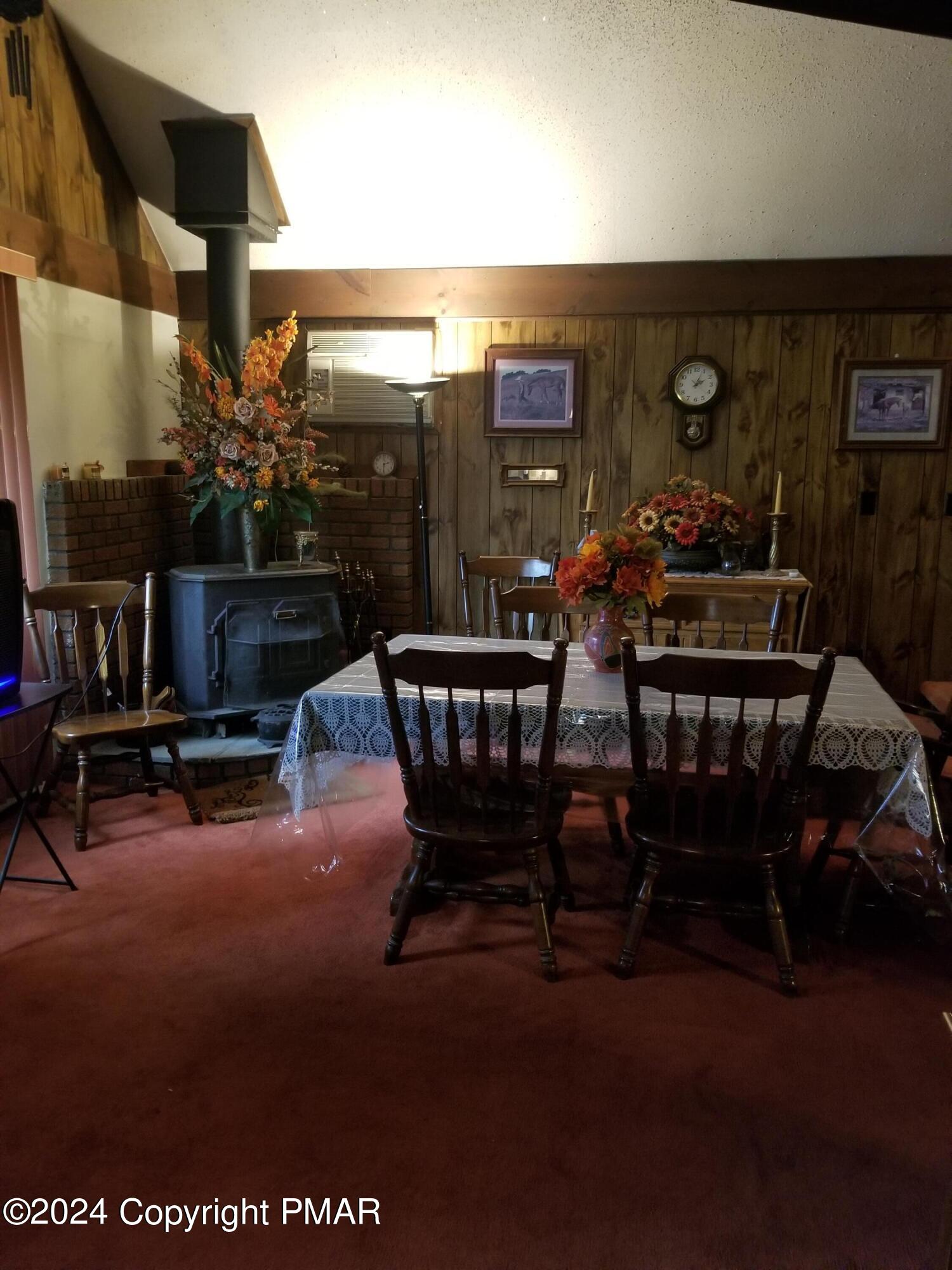 6349 Decker Road Bushkill, PA 18324 - Photo 10 of 28 a view of a dining room with furniture and chandelier