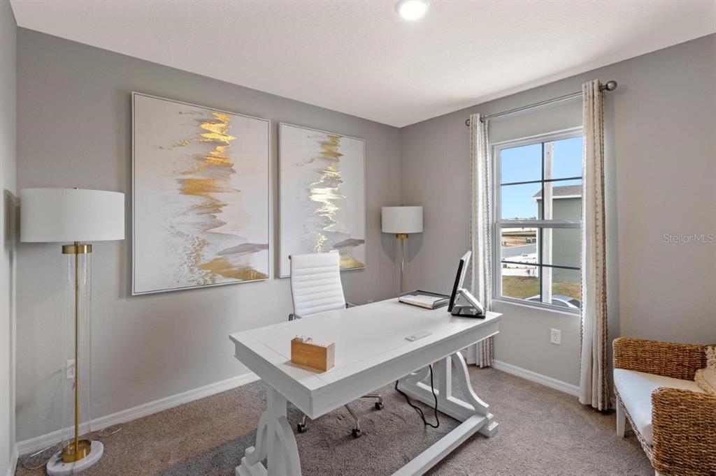 2729 Gladiola Road Winter Haven, FL 33884 - Photo 14 of 25 a view of a workspace with furniture and a window