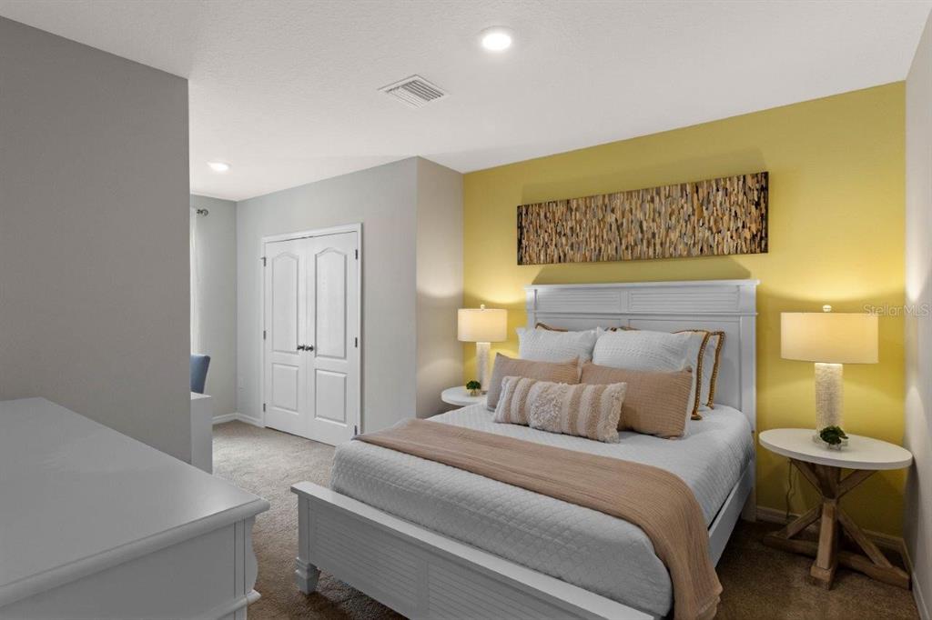 2729 Gladiola Road Winter Haven, FL 33884 - Photo 16 of 25 a bedroom with a bed and wooden floor