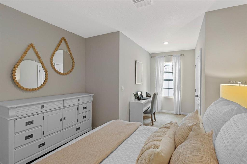 2729 Gladiola Road Winter Haven, FL 33884 - Photo 17 of 25 a bedroom with a bed and a dresser
