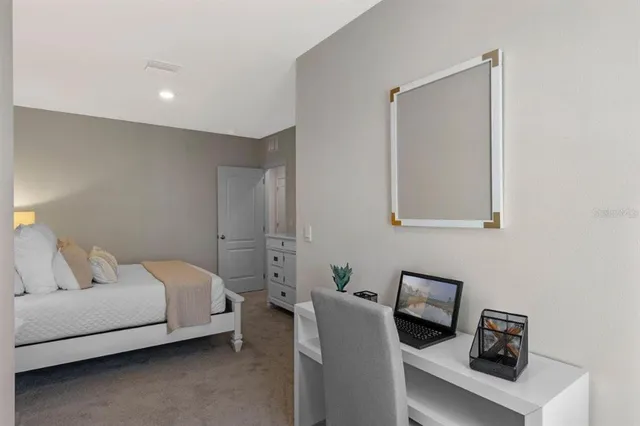 a bedroom with bed and window