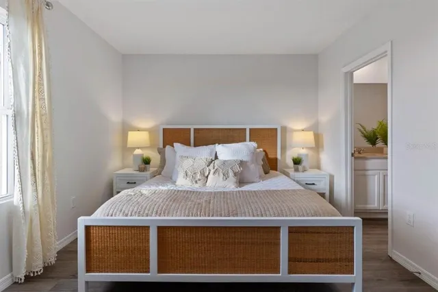 a bedroom with a bed and window