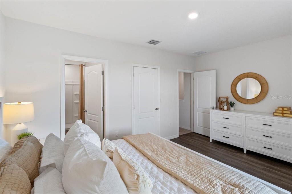 2729 Gladiola Road Winter Haven, FL 33884 - Photo 22 of 25 a bedroom with a bed and a dresser