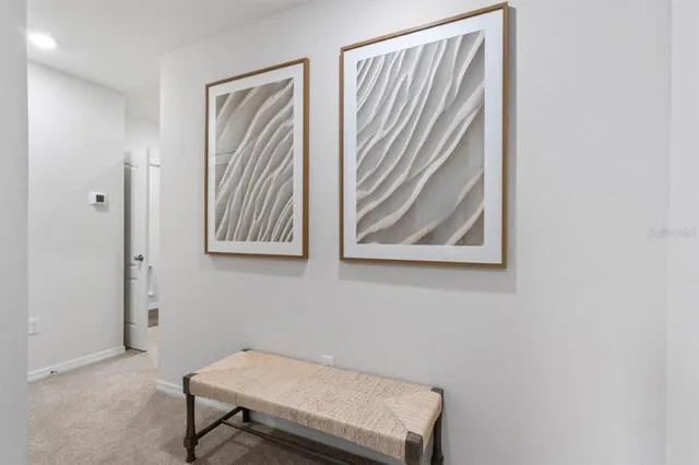 a bench sitting in a room next to a window