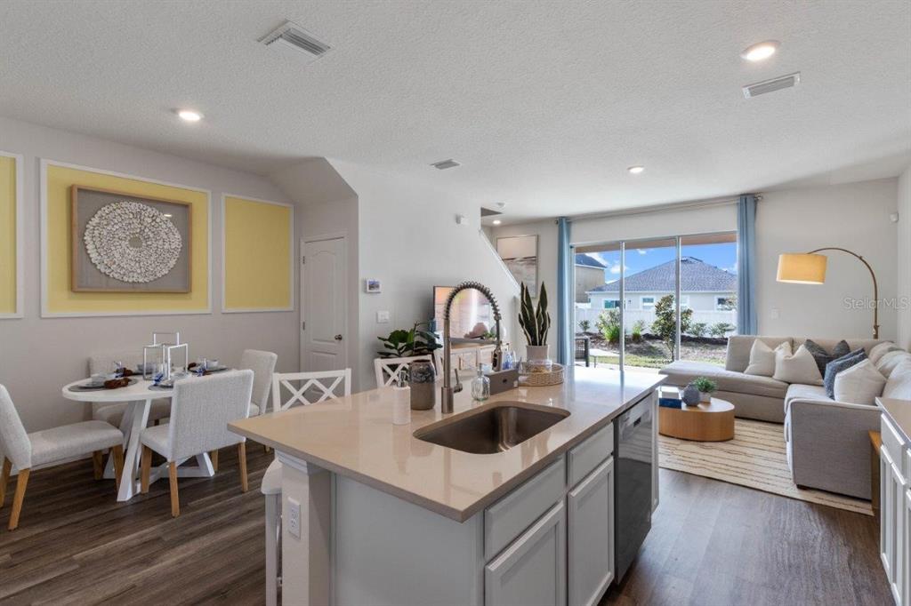 2729 Gladiola Road Winter Haven, FL 33884 - Photo 8 of 25 a kitchen with a sink cabinets and wooden floor