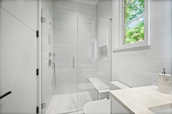 a bathroom with a sink and toilet