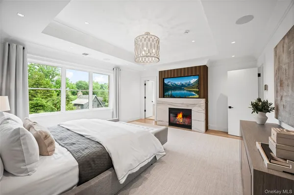 a bedroom with a bed and a fireplace