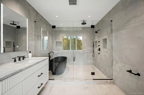 a living room with furniture and a bathtub